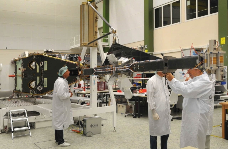 The Swarm satellite undergoes integration at Astrium’s facility in Friedrichshafen. The ASM probes are mounted on the end of the boom (right). Credits: Astrium / A. Ruttloff / 2010.